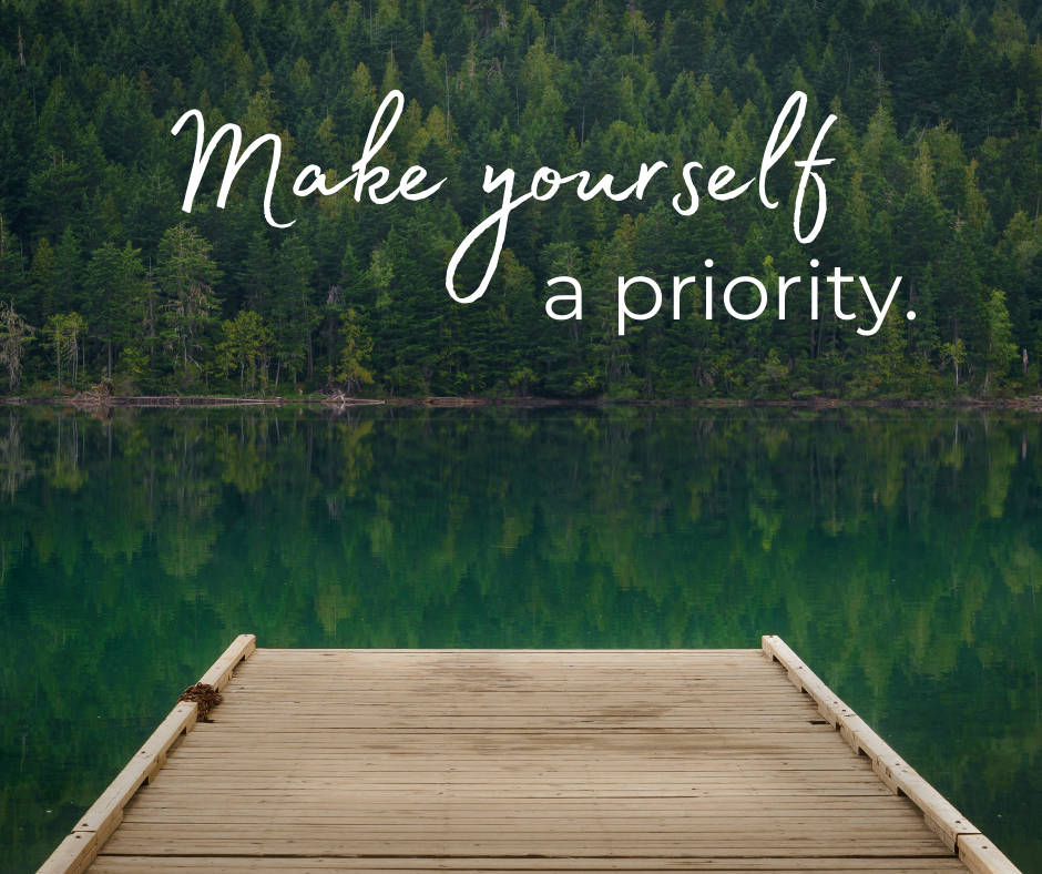 Dock over a lake in a forest with words "Make Yourself a Priority"